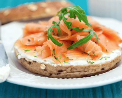 Smoked salmon bagel on a white plate